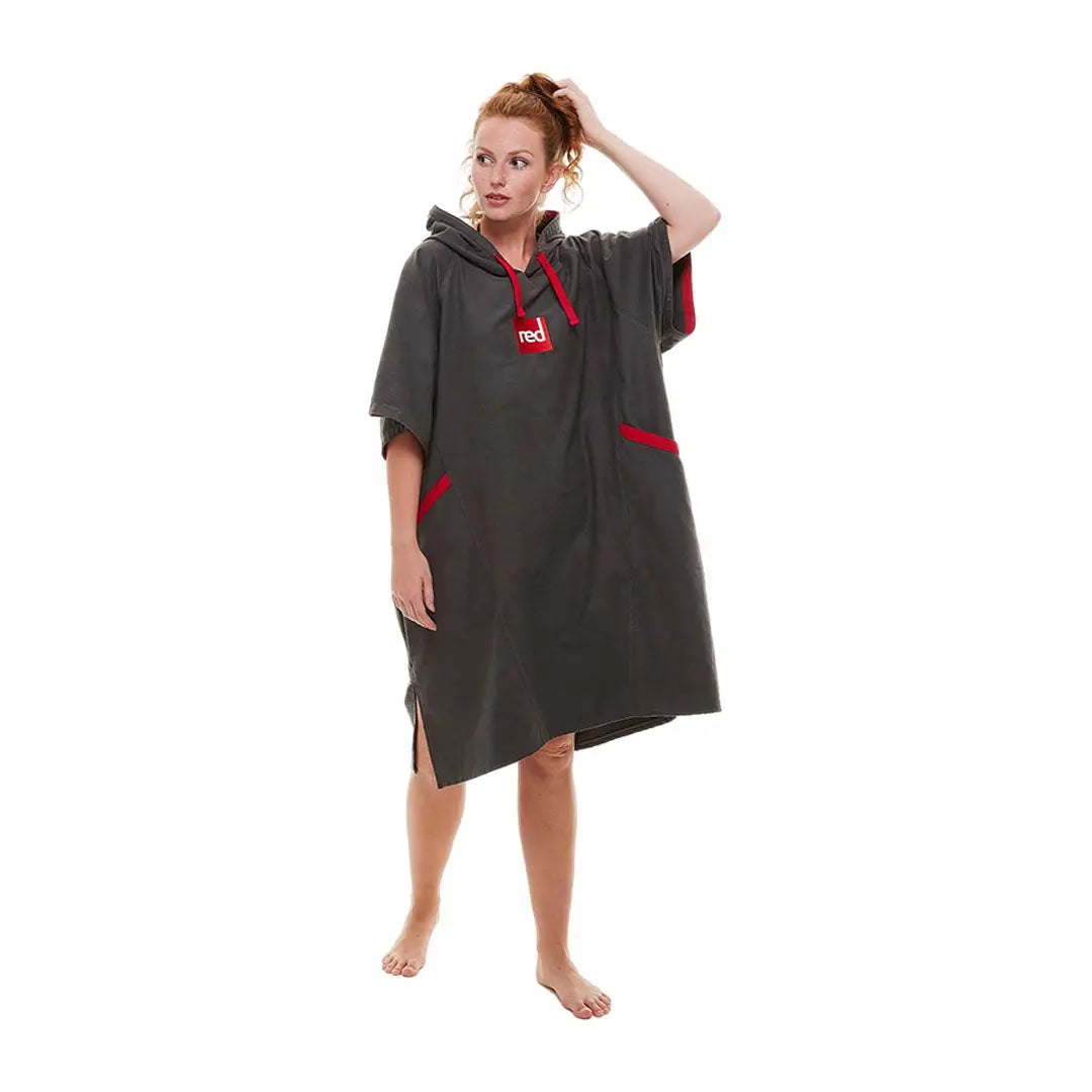 Person wearing a Red Quick Dry Microfibre Changing Robe with hood and fun accents