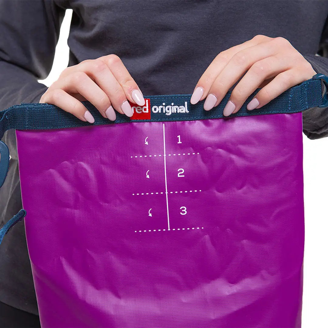 Compact 10L dry bag with purple design and measurement markings for easy planning