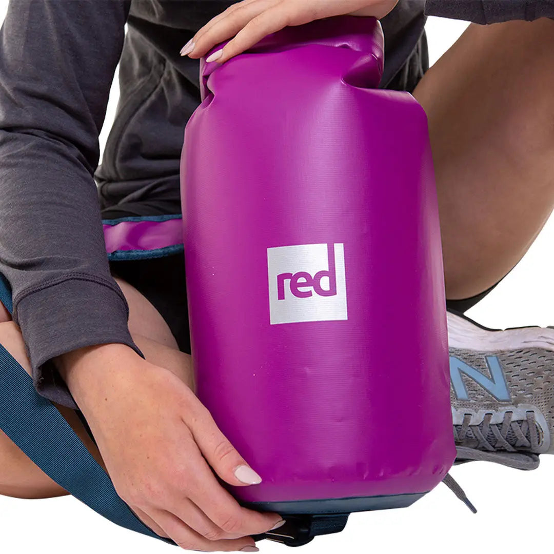 Bright purple 10L dry bag with red logo perfect for waterproof adventures