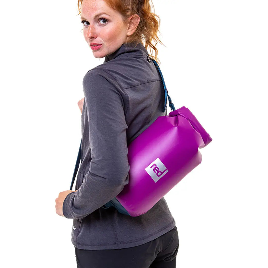 Bright purple compact 10L dry bag with shoulder strap for waterproof adventures