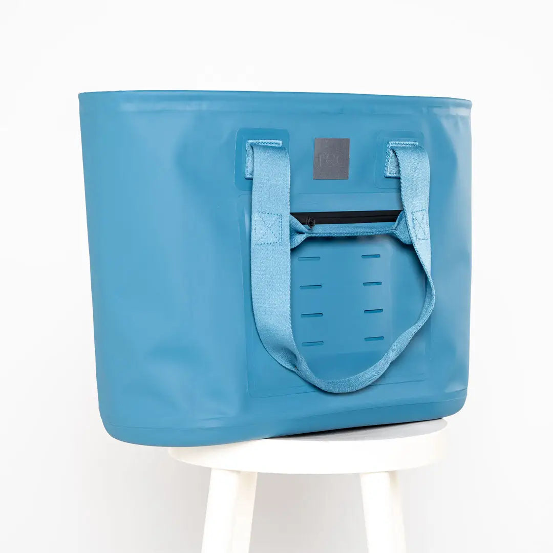 Light blue tote bag with front pocket perfect for country clothing and hunting trips