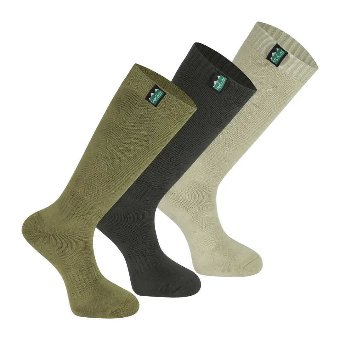 Three Ridgeline Cotton Work Socks in olive green, black, and beige for ultimate comfort