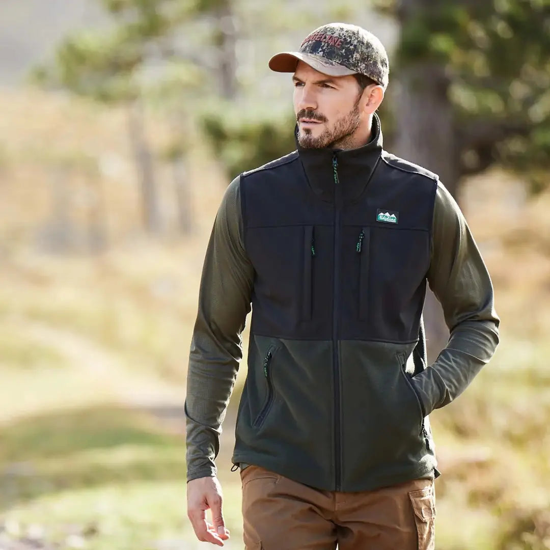 Man sporting a Ridgeline Hybrid Fleece Gilet with a cap and long sleeves