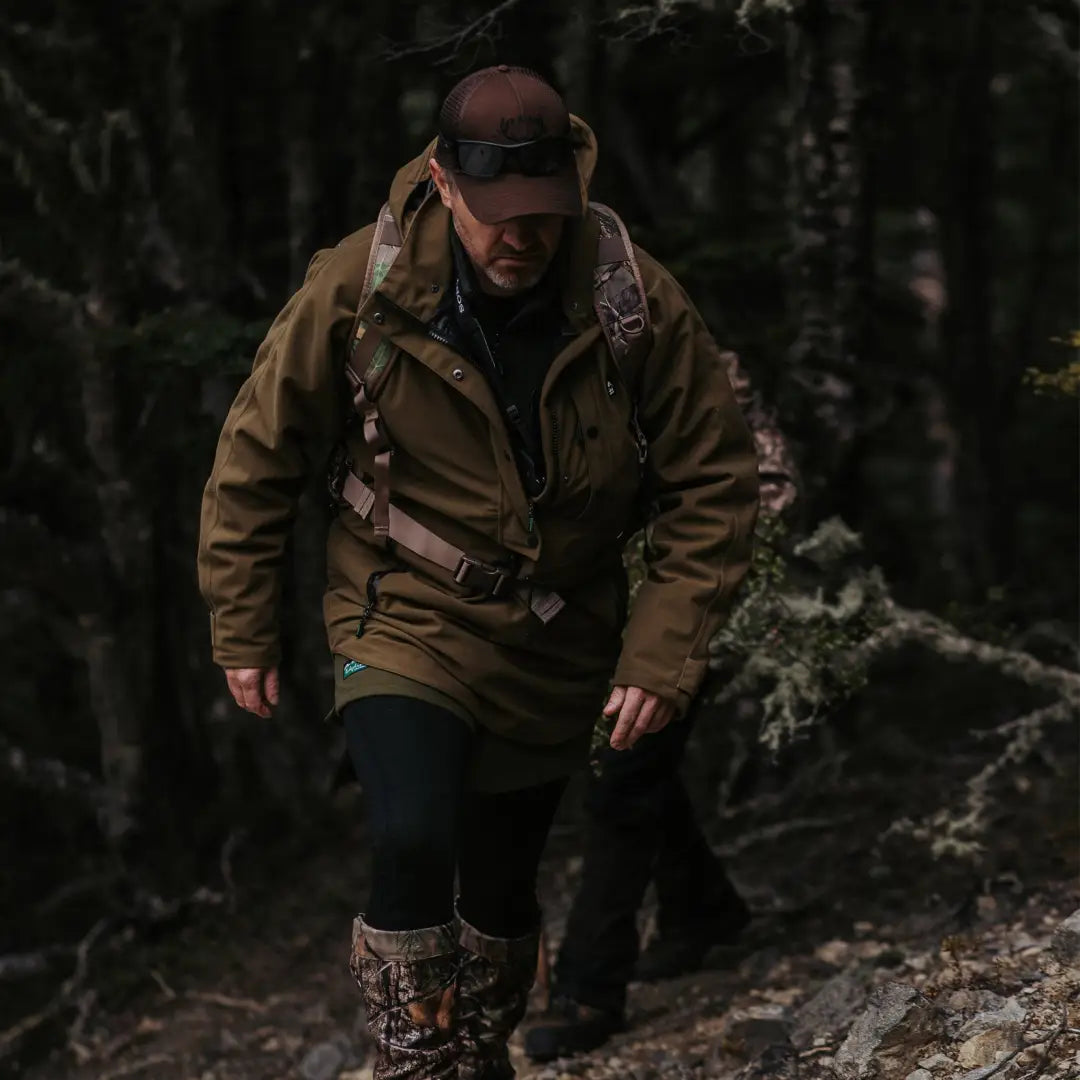 Hiker in a brown Ridgeline Monsoon Classic Waterproof Smock enjoying a forest walk