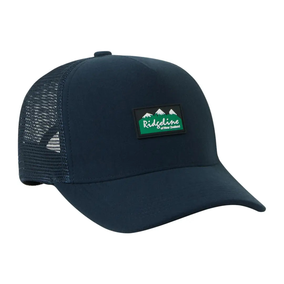 Navy blue Monsoon Trucker Cap with green mountain logo patch for outdoor style