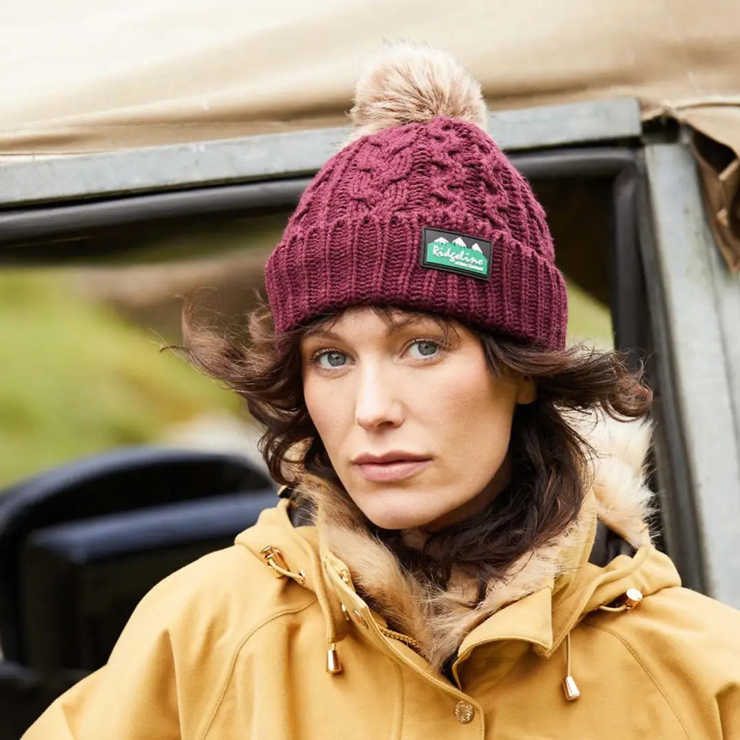 Burgundy Nordic Fleck Bobble Hat with a fluffy pom-pom on top for cozy style