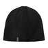 Black knit beanie hat with tag showing off the stylish Sealskinz Cley Hat vibe