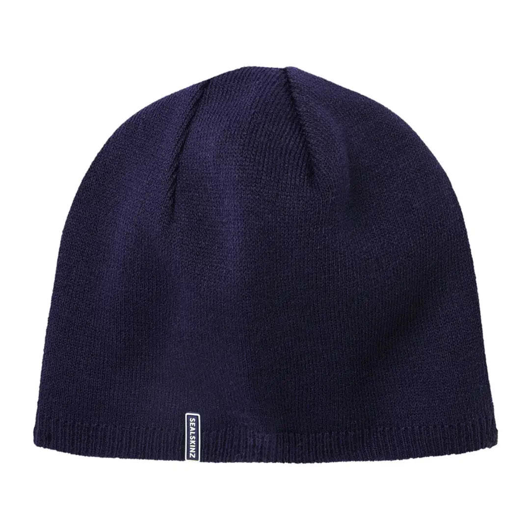 Navy blue knit beanie hat with label perfect for country clothing and outdoor adventures