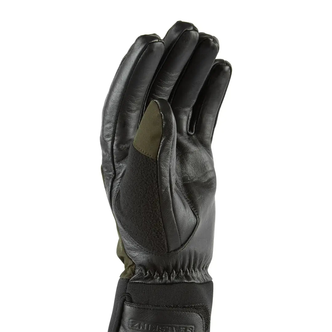 Black leather Sealskinz Fordham Hunting Glove with green patch, a waterproof gun cut glove