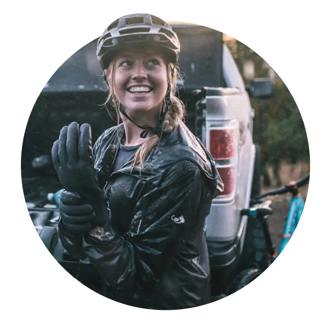 Smiling cyclist in Sealskinz Howe Glove giving thumbs-up for weather multi-activity fun