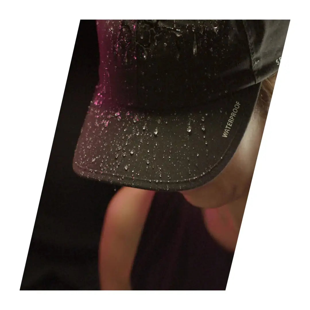 Sparkly dark skirt hem and bare legs styled with a waterproof cap made for the running game