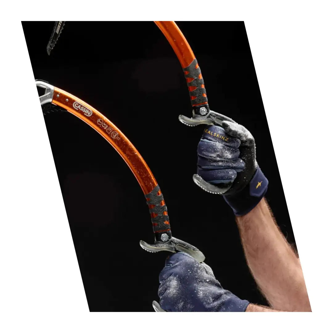 Ice climbing axes gripped by Sealskinz Lyng Glove for ultimate fusion control and weather protection