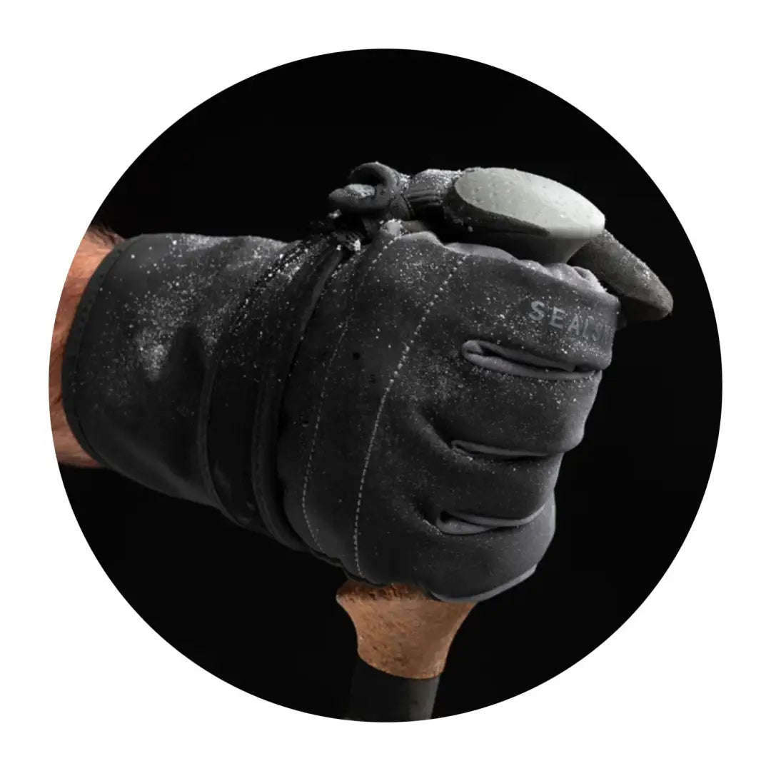 Black leather boxing glove on hand showcasing Sealskinz Lyng Glove for wet weather use