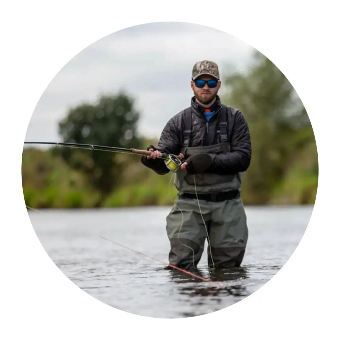 Fisherman in water with lightweight windproof mitt for high performance fishing