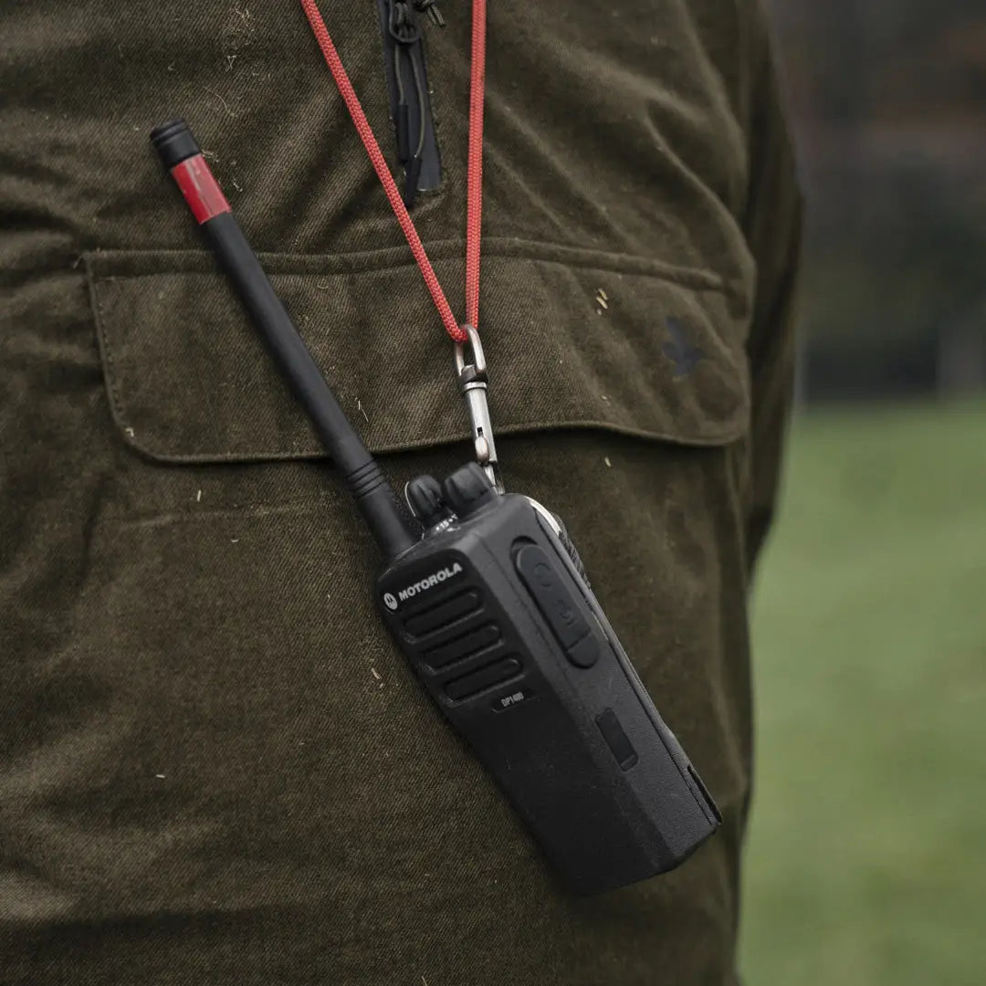 Handheld two-way radio on Seeland Avail Smock with a red lanyard for easy access