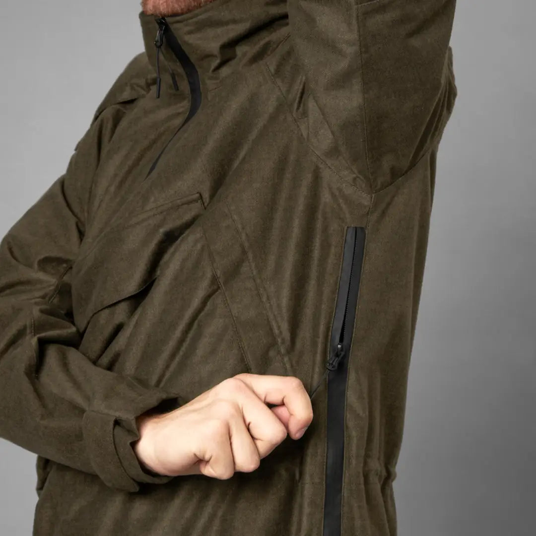 Olive green waterproof Seeland Avail Smock featuring a zipper pocket for convenience