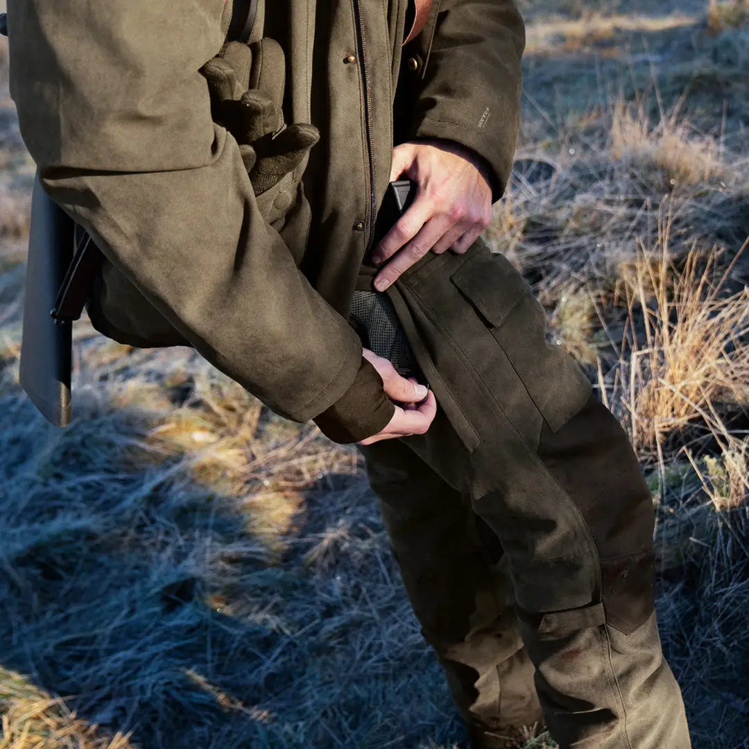 Olive green Seeland Helt II Trousers for stand hunting in late autumn grass