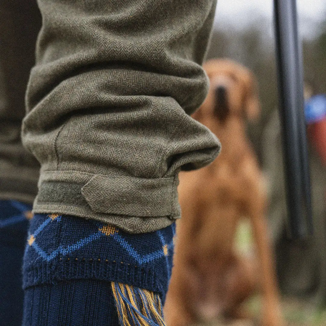 Blue patterned scarf from the Hillside Collection’s Seeland Harriet Breeks wrapped around a person