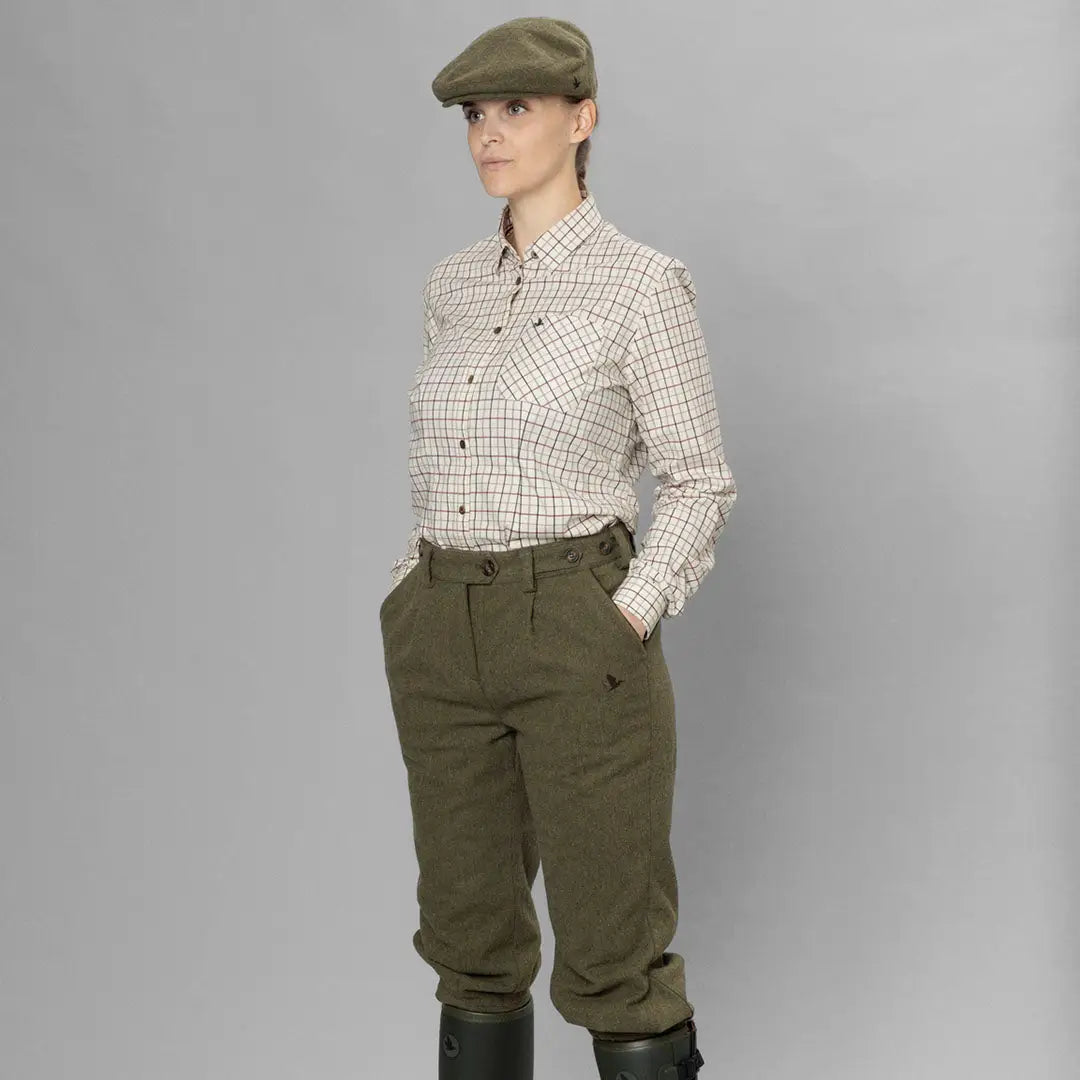 Person in flat cap and checkered shirt wearing Seeland Hillside Harriet Breeks