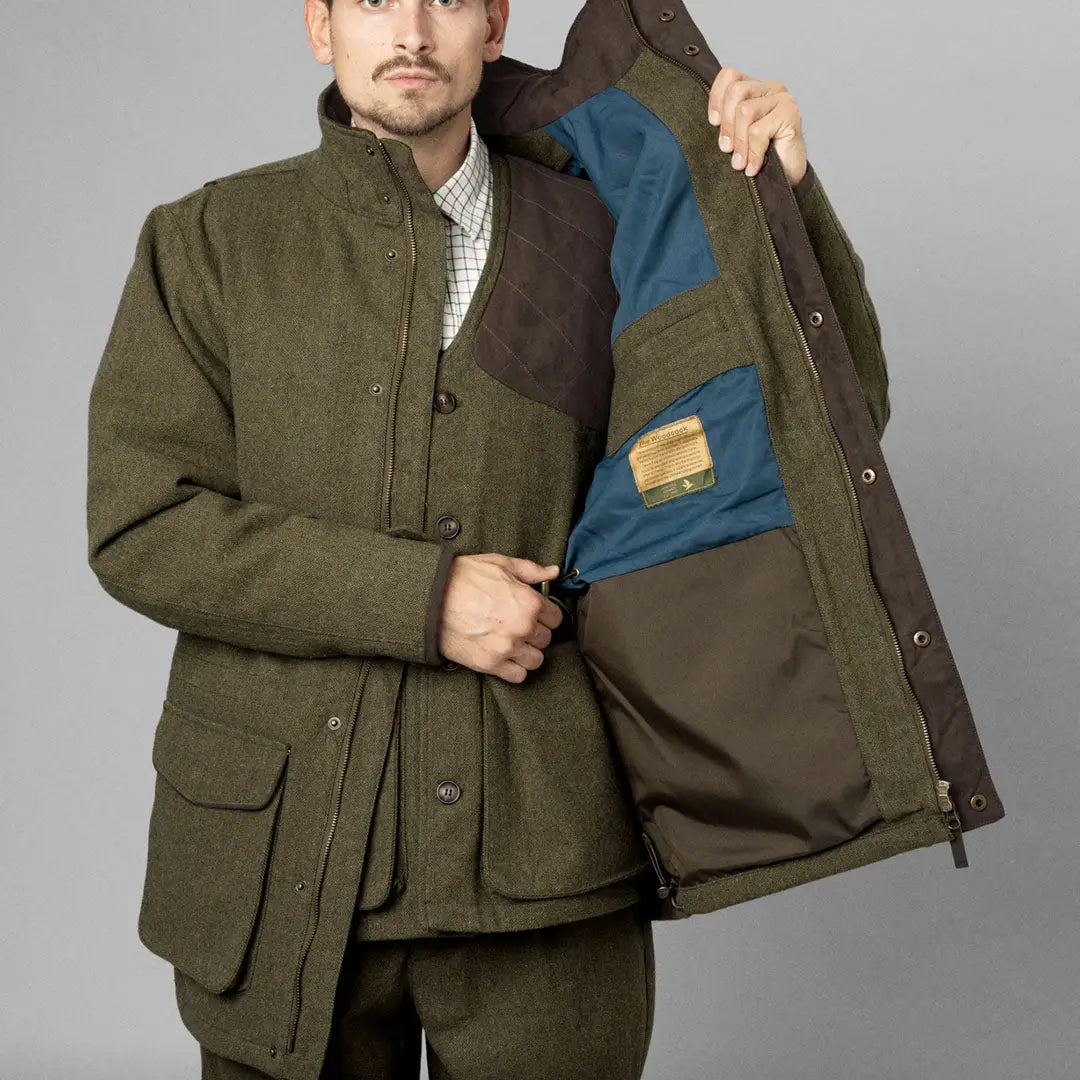 Olive green Seeland Hillside Jacket with pockets and blue lining for outdoor adventures