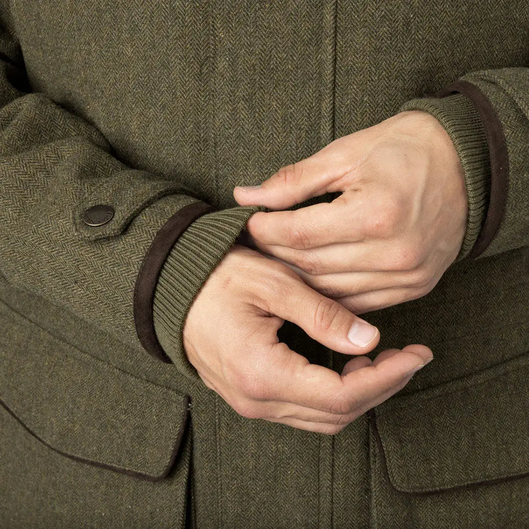 Olive green Seeland Hillside Jacket being styled with a cuff adjustment