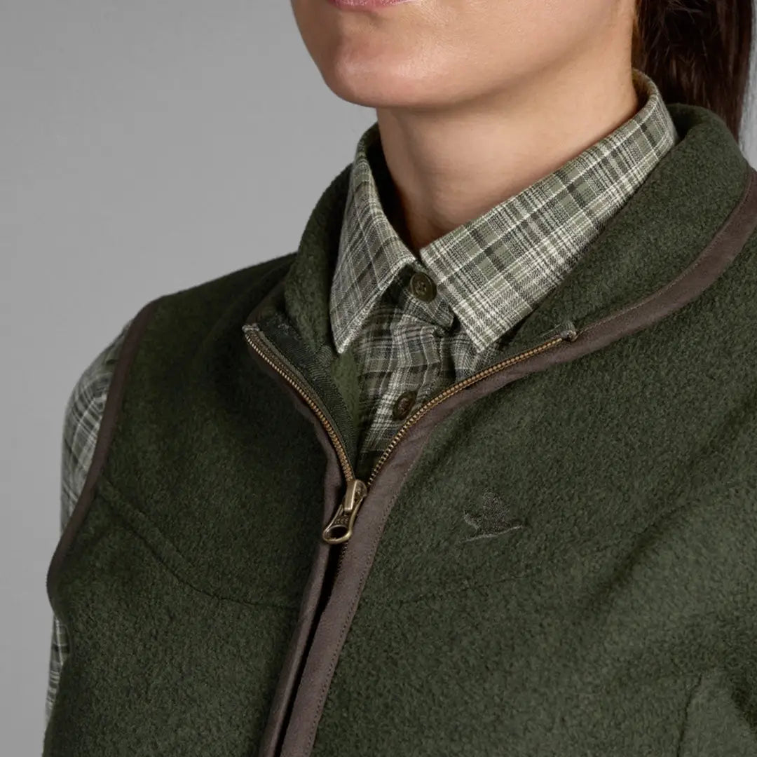 Green Seeland Ladies Woodcock Fleece Waistcoat over a plaid shirt for cozy style