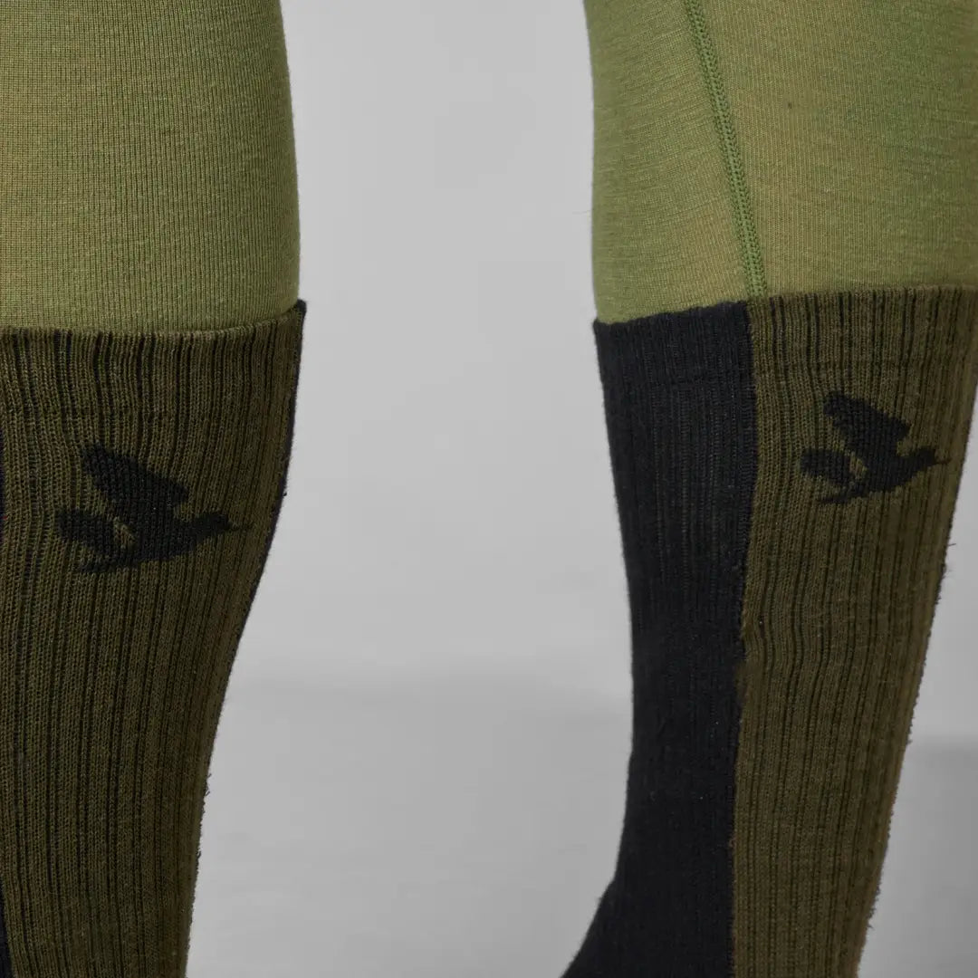 Pair of green Seeland Moor socks with bird logos for stylish comfort and fun