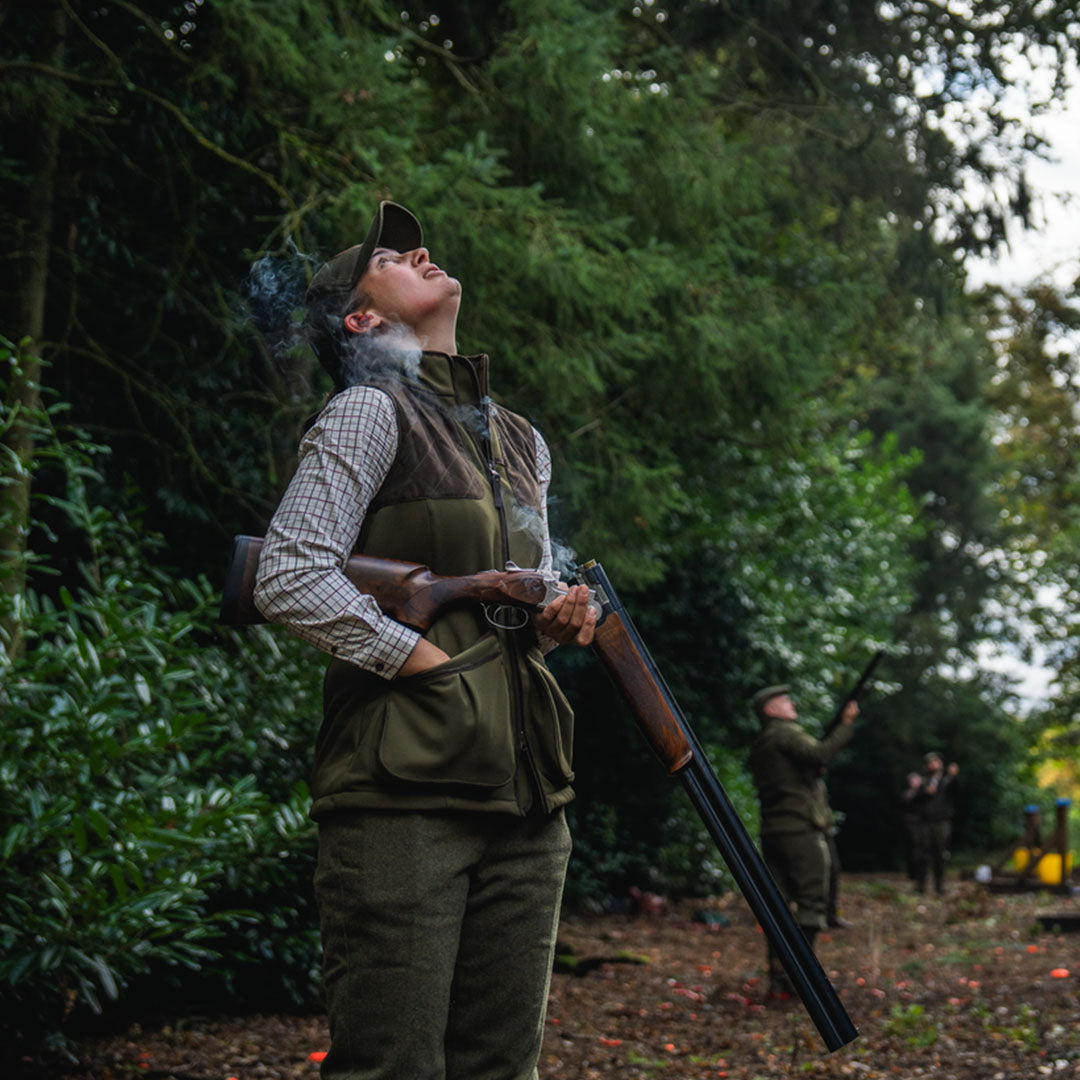 Woman with shotgun in Seeland Wenlock Faye Ladies Waistcoat for stylish hunting