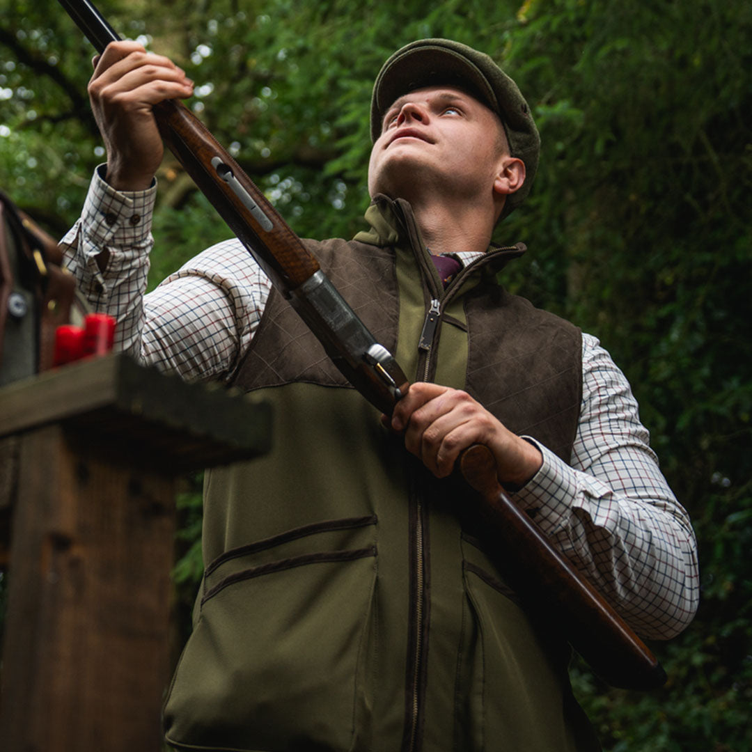 Man holding a shotgun in Seeland Wenlock Mens Waistcoat for hunting and country clothing