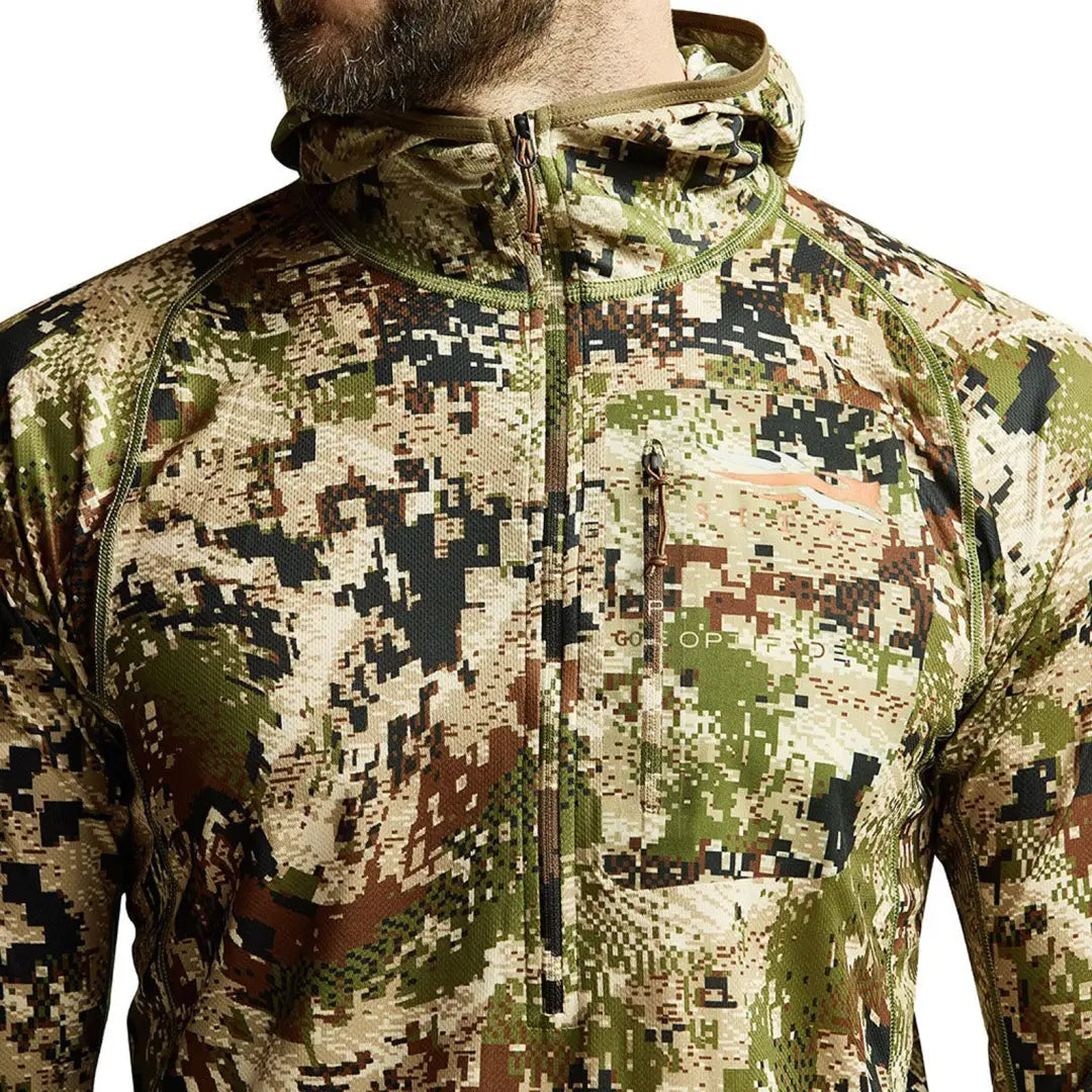 Camouflage pixelated pattern on Sitka Core Lightweight Hoody in green, brown, beige