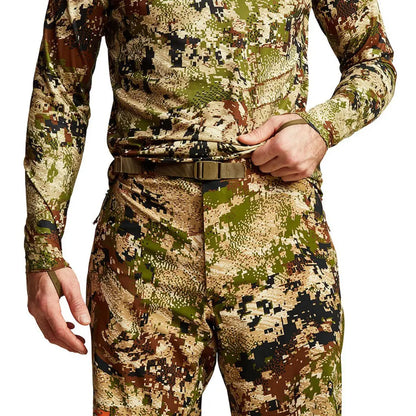 Camouflage Sitka Dew Point Pants featuring a digital pixelated earth tone pattern