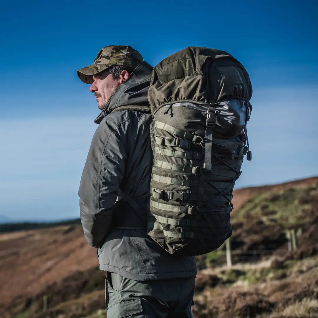 Hiker rocking a Snugpak Endurance 40L Tactical Rucksack in the great outdoors