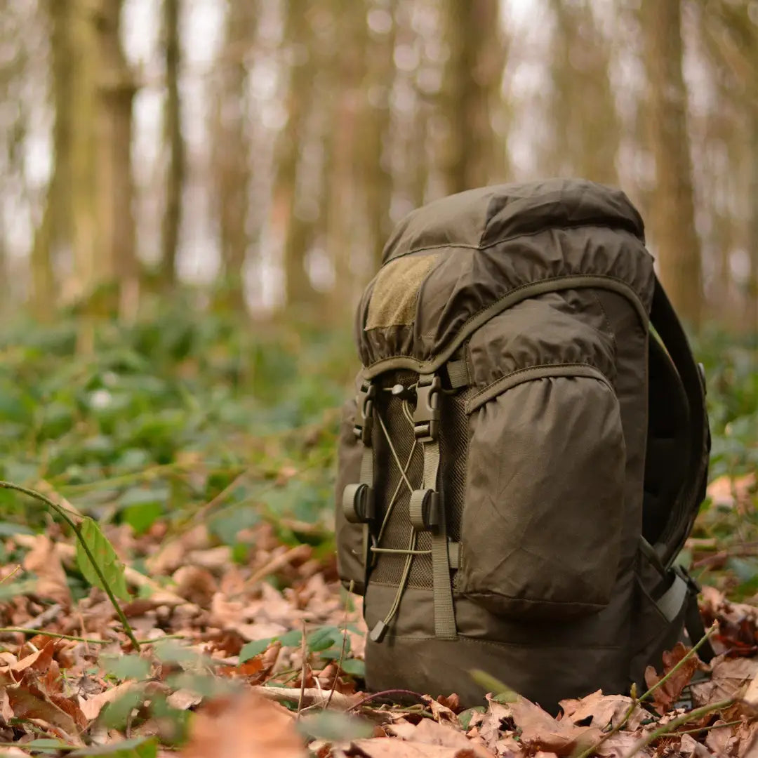 Olive green Snugpak Sleeka Force backpack on autumn leaves showcasing intelligent design feature