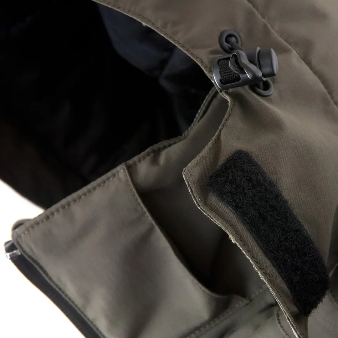 Zipper and fastener detail on Snugpak Torrent Waterproof Insulated Jacket in khaki