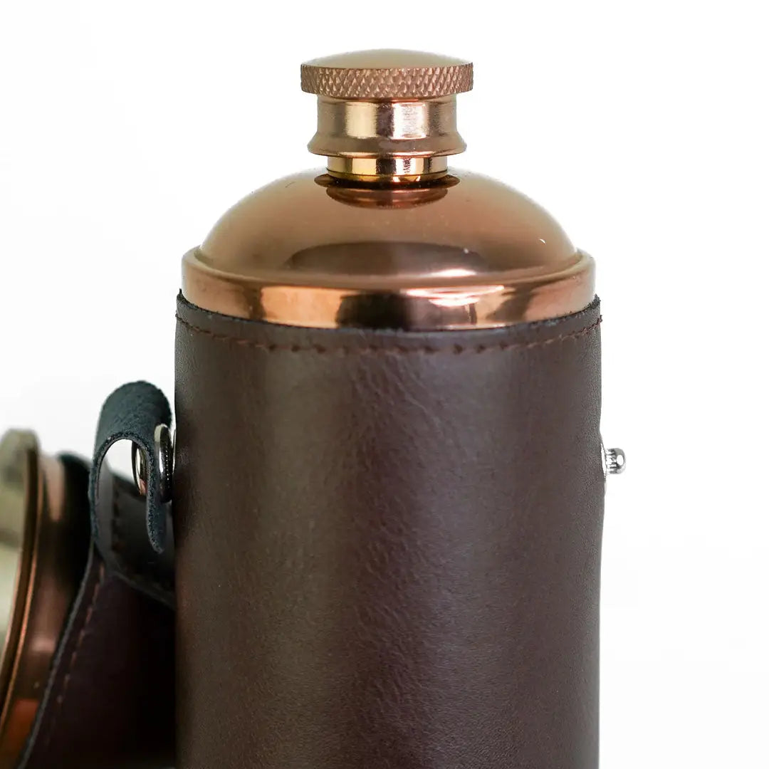 Stylish 8oz Copper Hunters Flask with brown leather cover and knurled cap