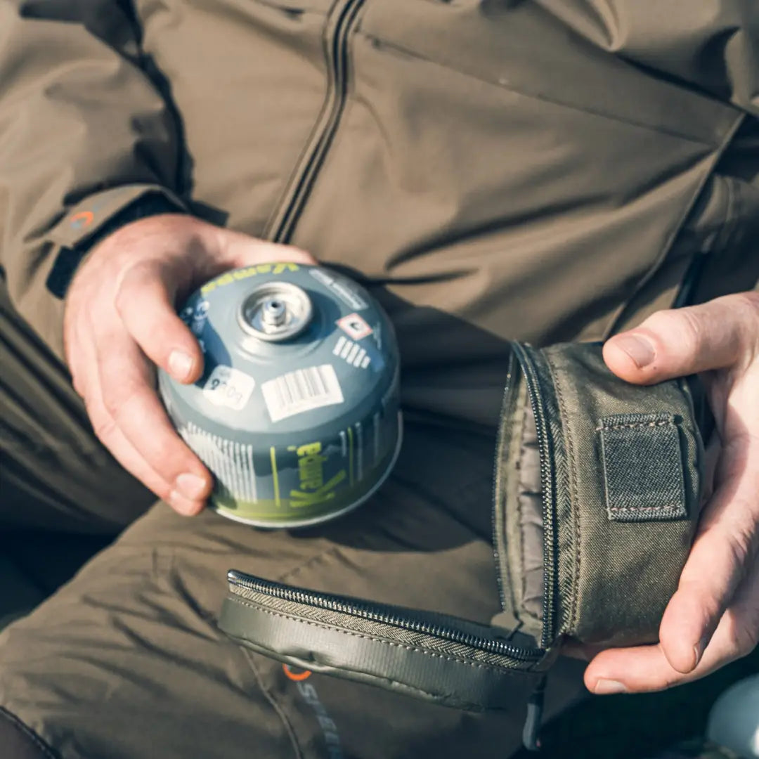 Camping gas canister sliding into a pocket of the Speero Gas Canister Cover