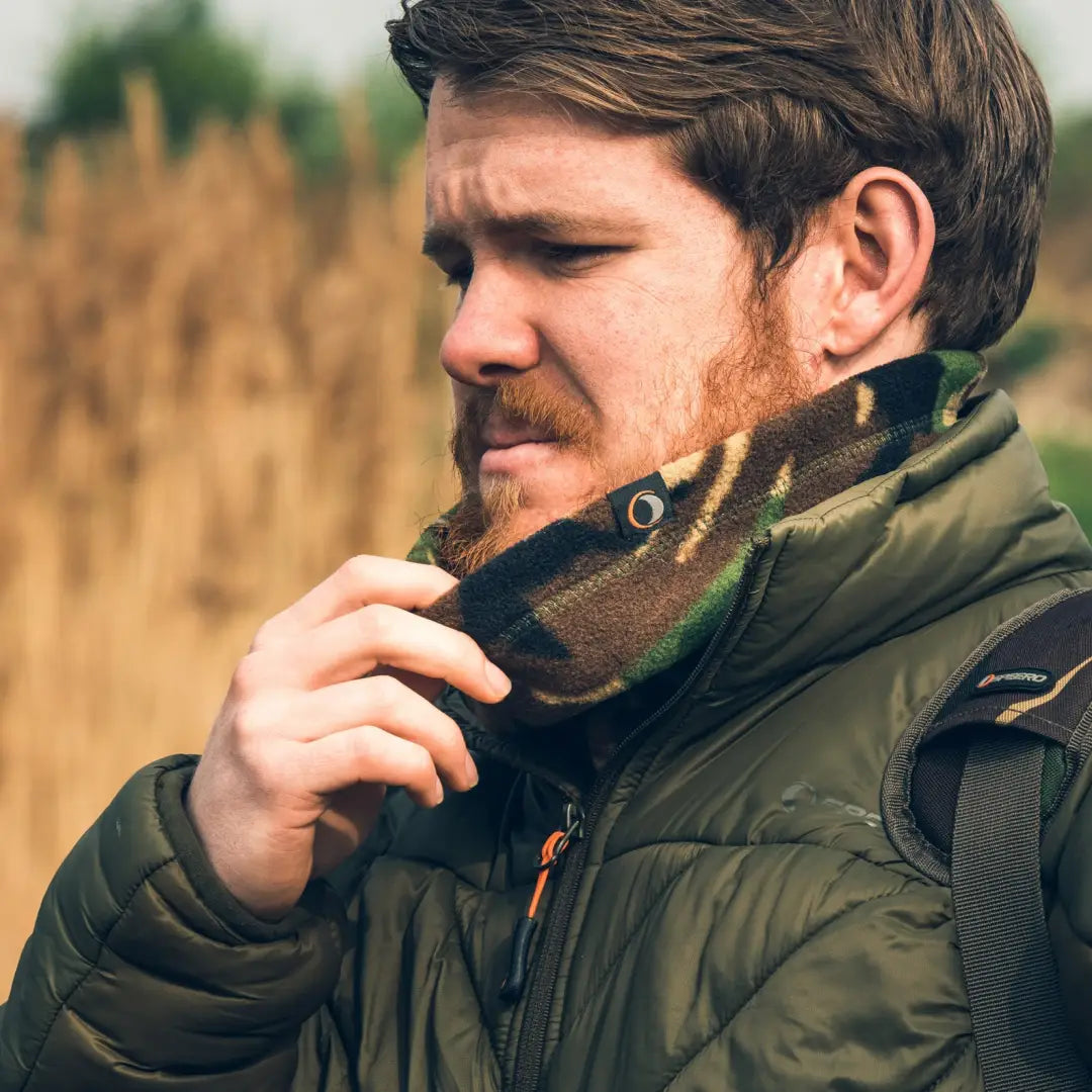 Man with a beard in a green puffy jacket and scarf showcasing Speero Neck Gaiter