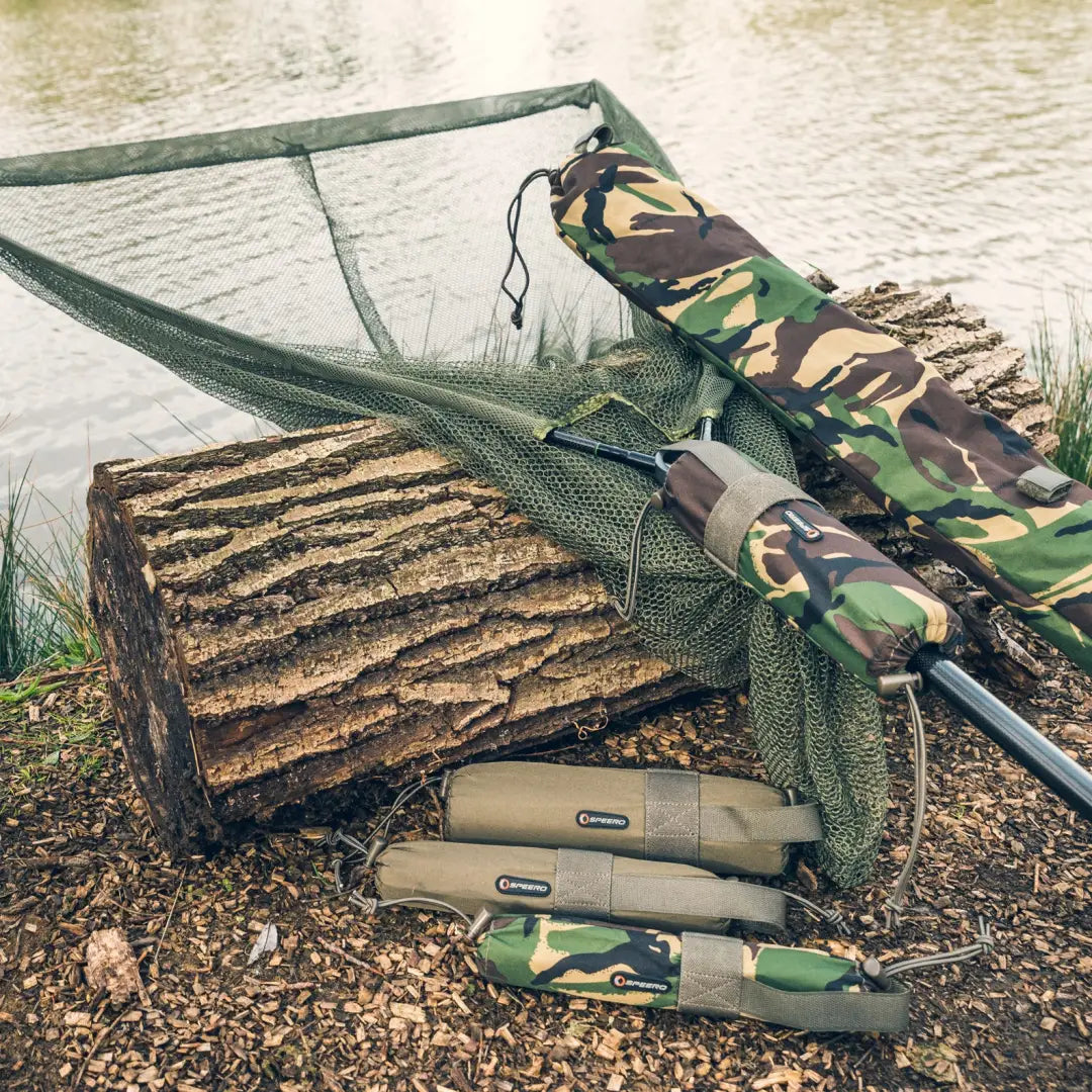 Fishing rod and camouflage gear near water with Speero Net Retention Float