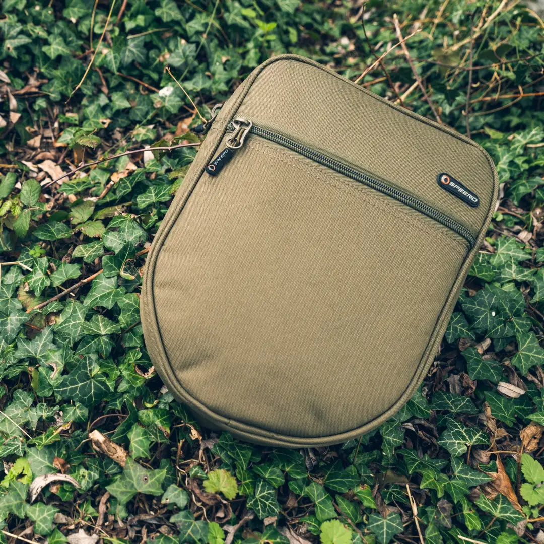 Khaki Speero Scales Pouch on foliage, perfect for your outdoor gear storage