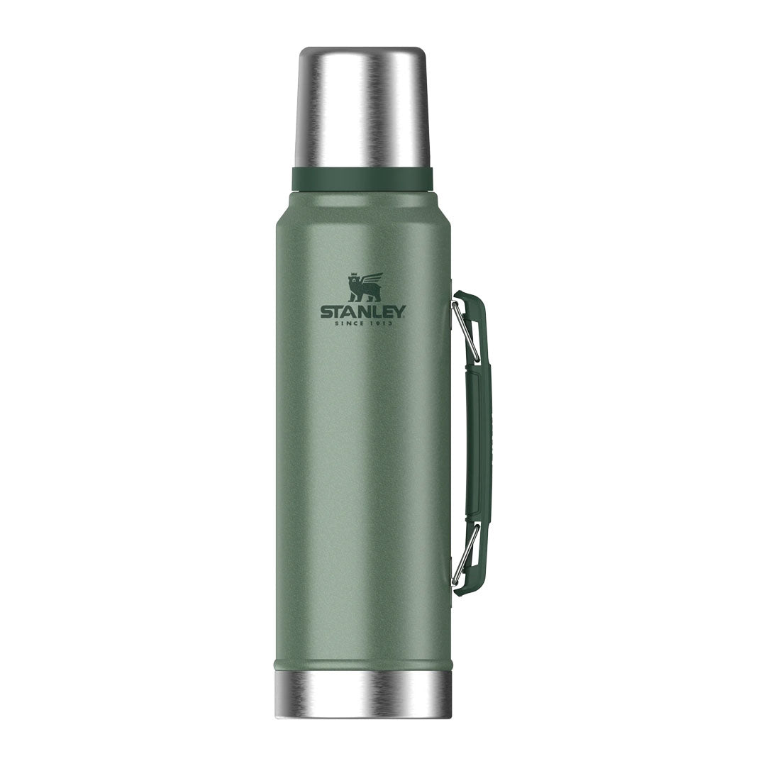 Green Stanley thermos with handle, perfect for outdoors and hunting adventures