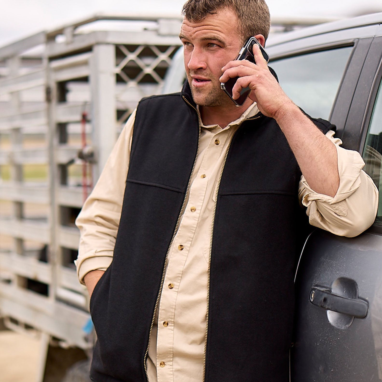 Man in black vest talking on phone wearing Swanndri’s popular Bendigo relaxed fit work shirt