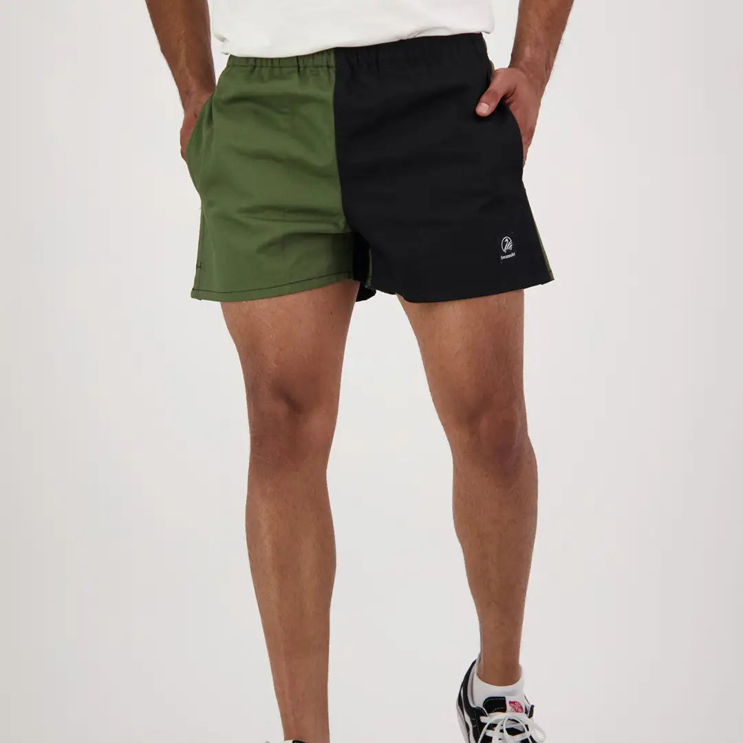 Two-tone green and black harlequin rugby shorts from Swanndri for a sporty vibe