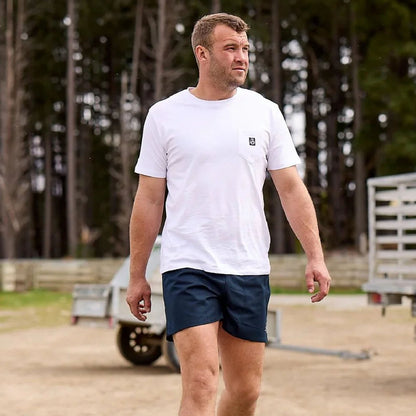 Man in white t-shirt and navy shorts wearing Swanndri Cotton Rugby Shorts