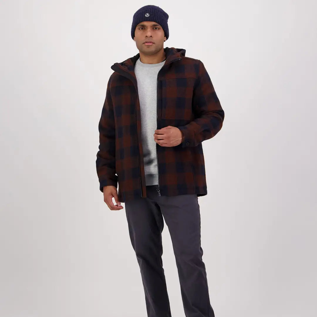 Man in plaid jacket and navy beanie rocking a Hudson Wool Hoody style