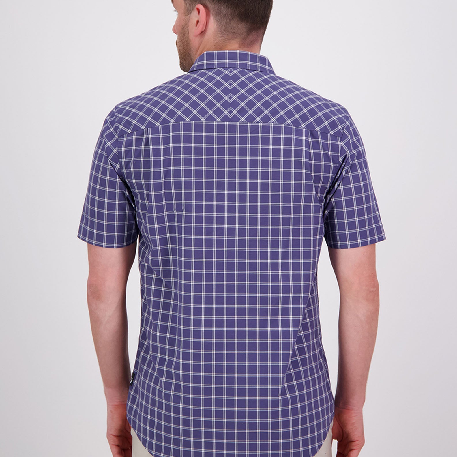 Blue and white checkered short-sleeved Swanndri Lancewood Shirt, perfect for country clothing outdoors