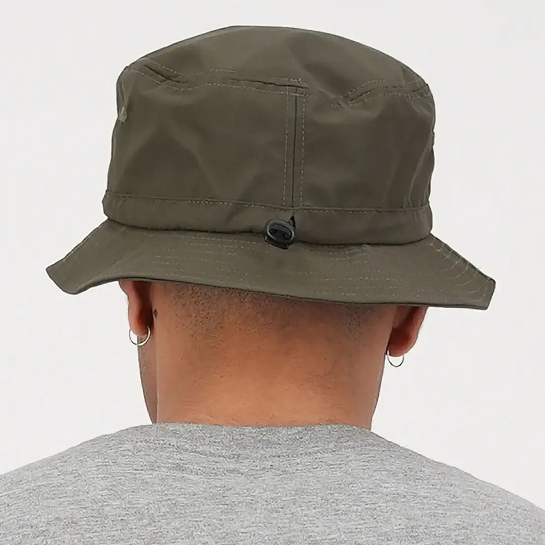 Olive green bucket hat with button, perfect for country clothing and hunting adventures