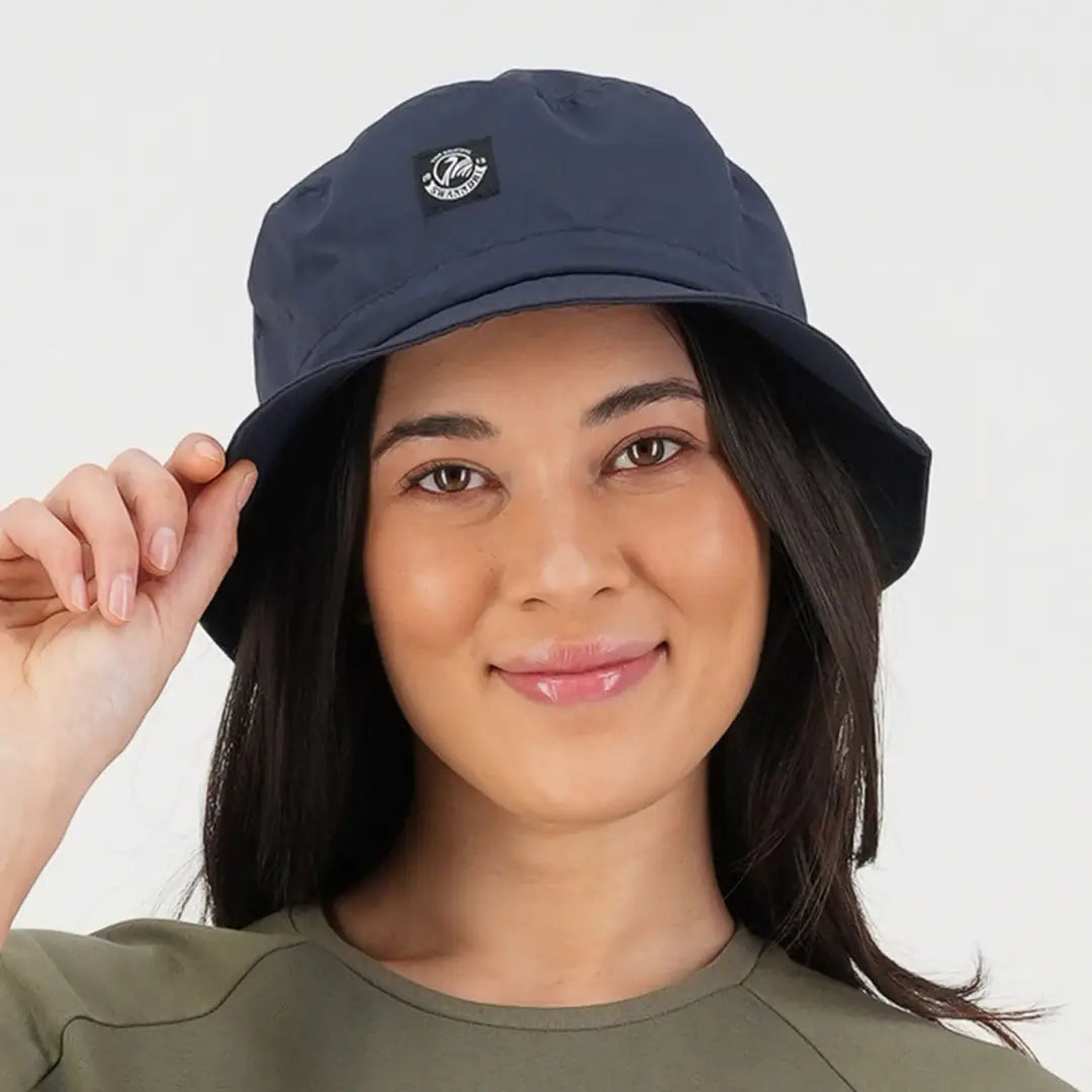 Navy blue bucket hat with emblem, perfect for country clothing and hunting adventures