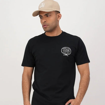 Man in a black t-shirt and beige cap, perfect for country clothing and outdoors vibes