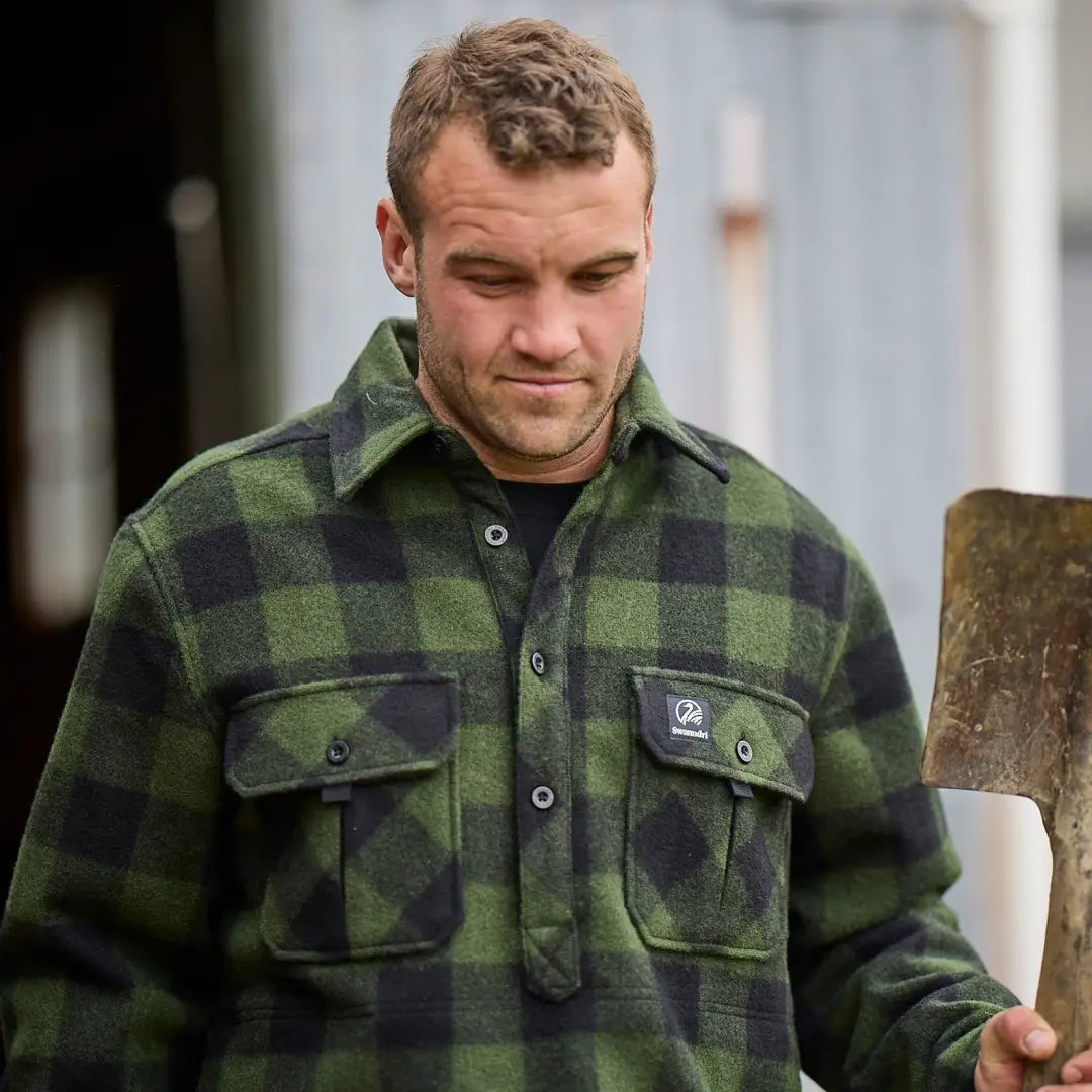 Man rocking a green and black plaid flannel in the Swanndri Ranger Extreme V2