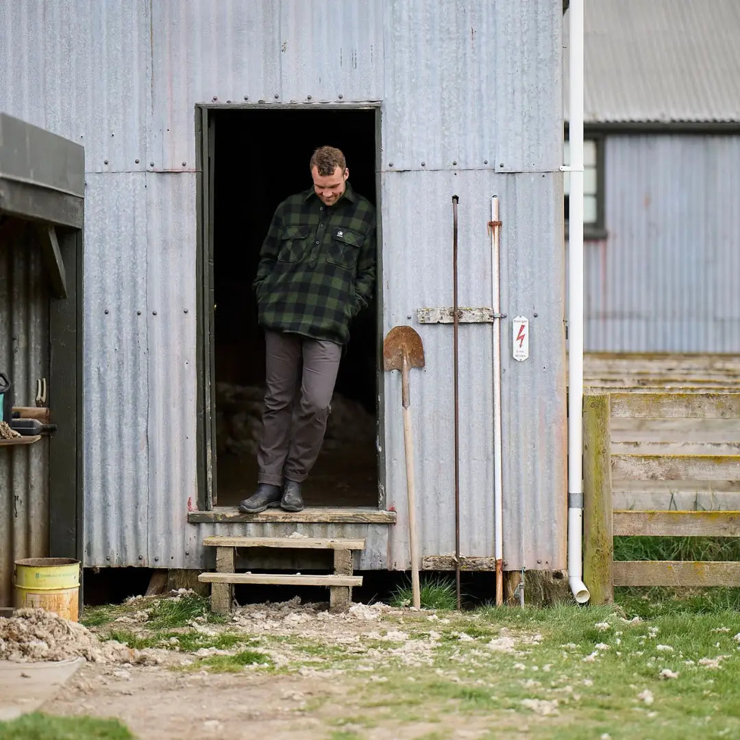 Person in a doorway wearing Swanndri Ranger Extreme V2 in a metal shed